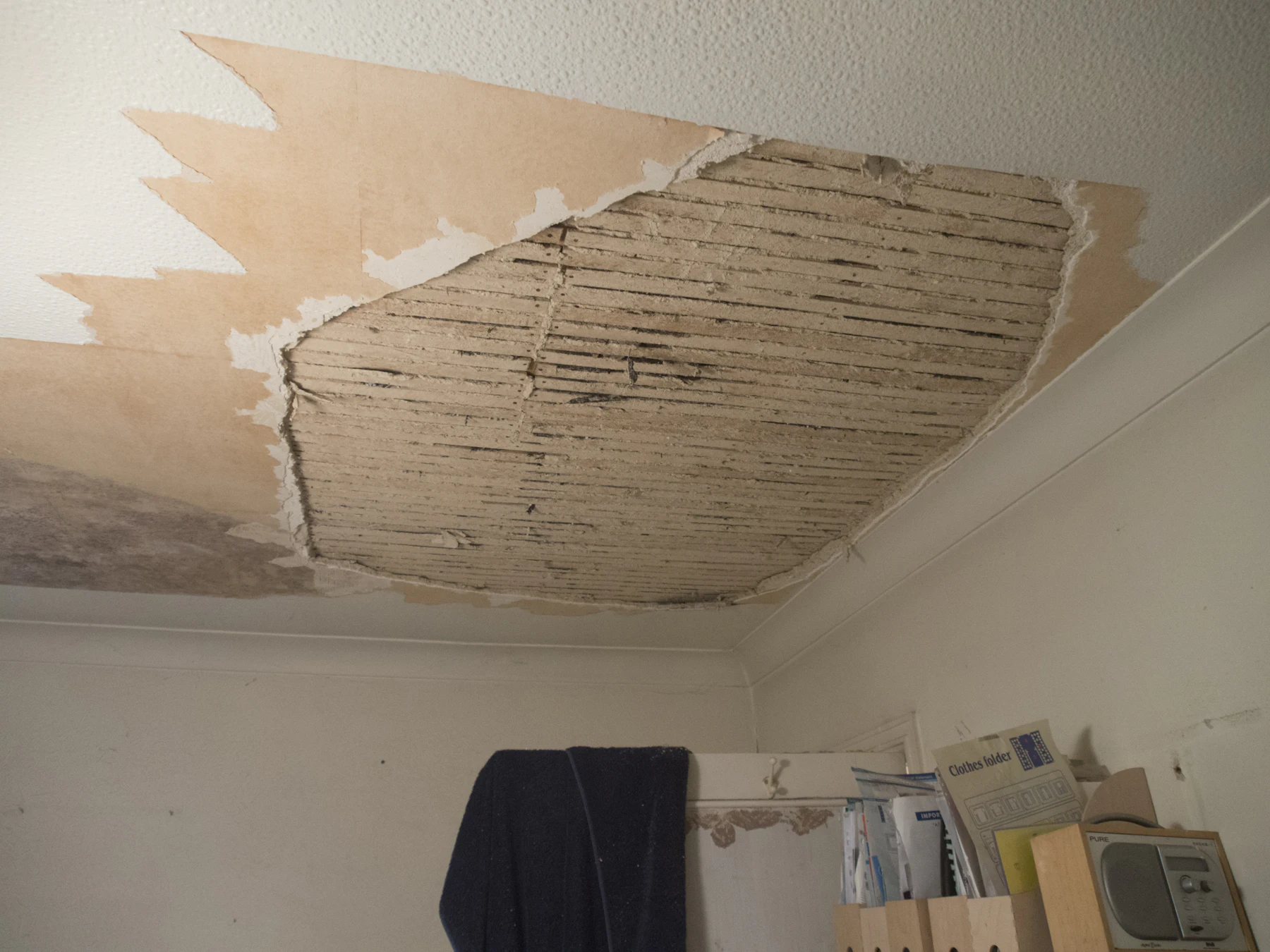 A room with the ceiling opened up and material removed after a water loss